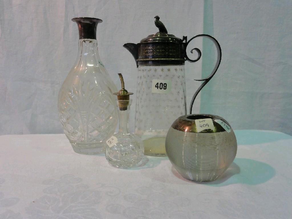 Appraisal: A glass decanter with silver mounted neck a vesta strike