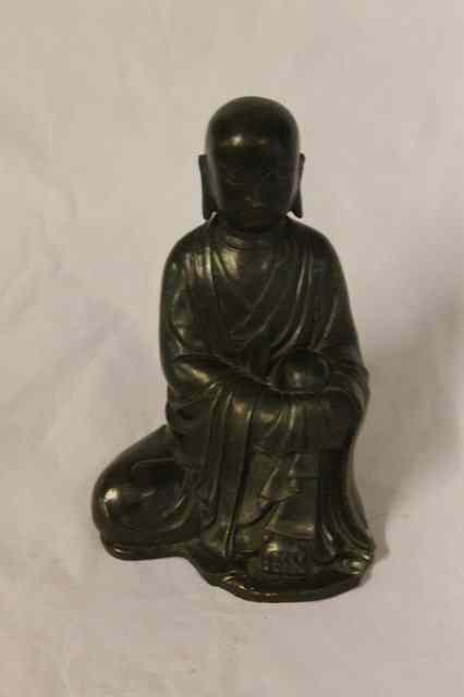 Appraisal: A CHINESE BRONZE KNEELING BUDDHA th th Century