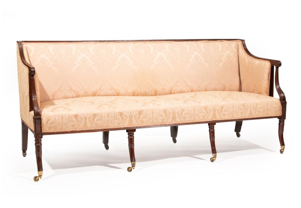 Appraisal: REGENCY-STYLE CARVED MAHOGANY SOFAAntique Regency-Style Carved Mahogany Sofa reeded crest