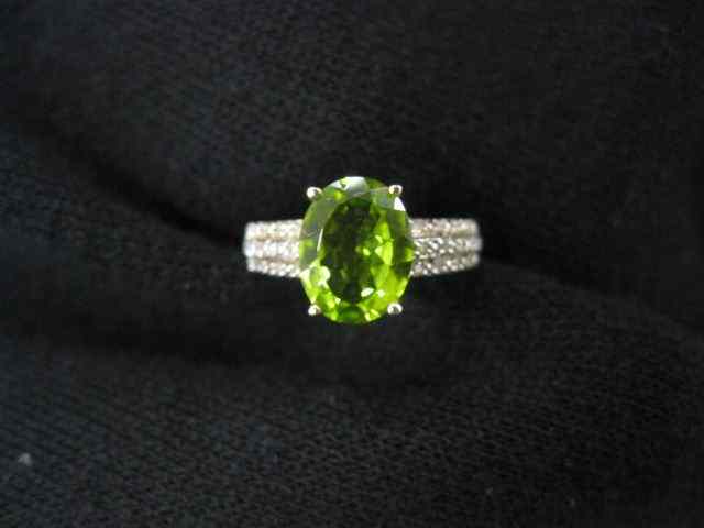 Appraisal: Peridot Diamond Ring oval gem weighing carats with diamonds on