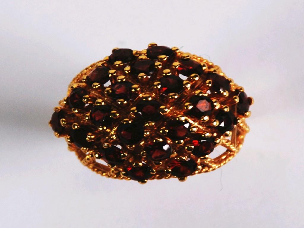 Appraisal: ct GOLD AND RUBY DOME SHAPED DRESS RING the trellis