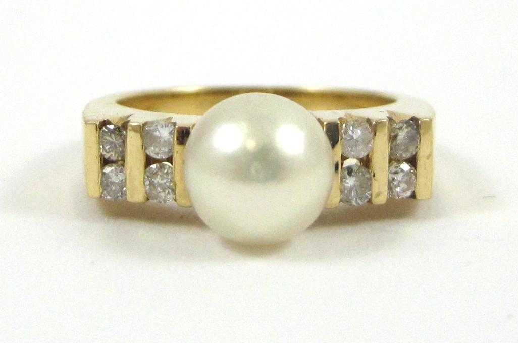 Appraisal: PEARL DIAMOND AND FOURTEEN KARAT GOLD RING with four round-cut