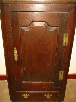 Appraisal: A GEORGE III OAK CORNER CUPBOARD th century the moulded