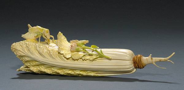 Appraisal: A tinted and pieced ivory cabbage and insect group th