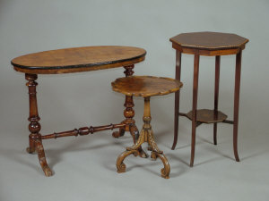 Appraisal: An Edwardian mahogany and inlaid octagonal two tier occasional table