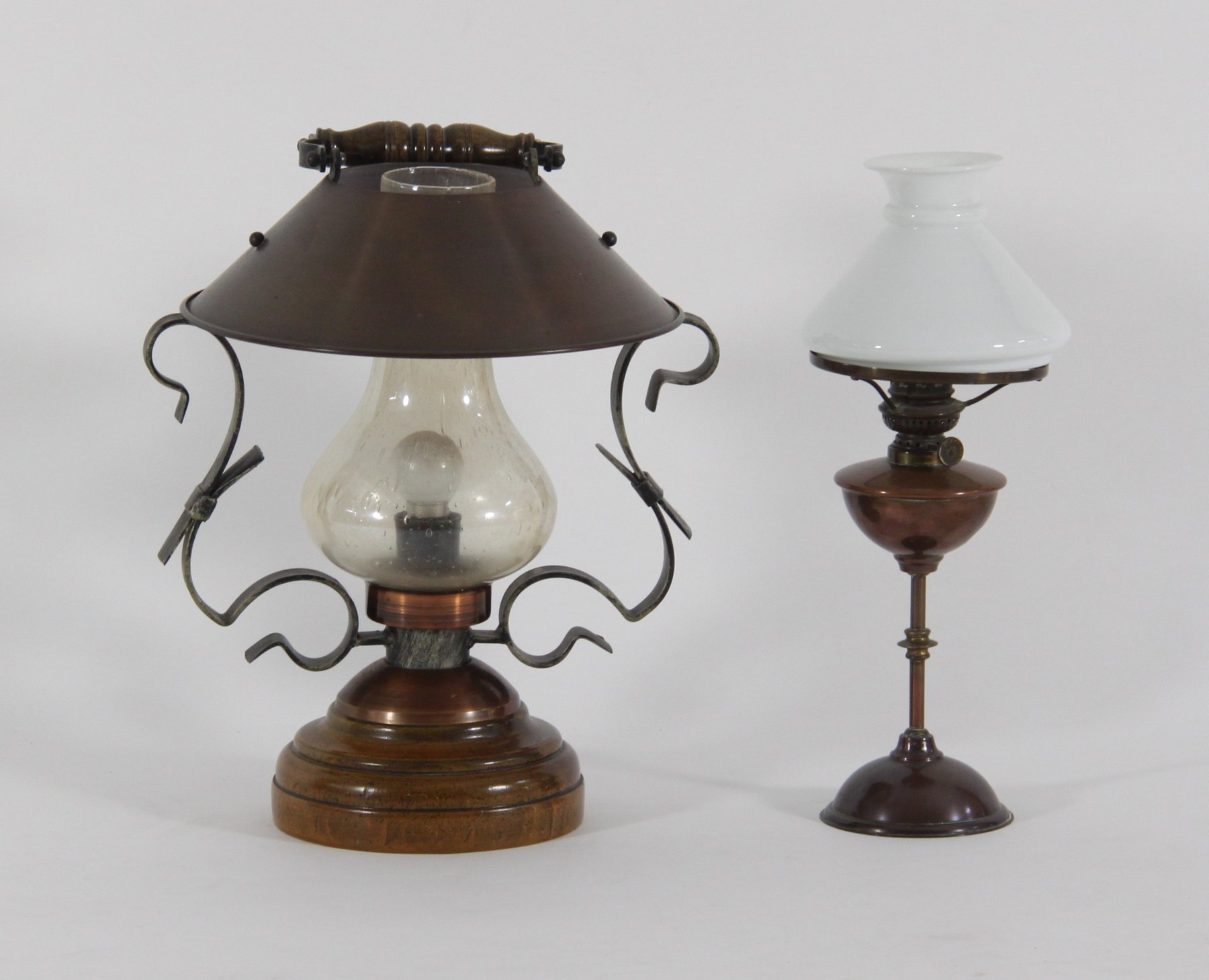 Appraisal: A copper oil lamp with glass shade cm high and