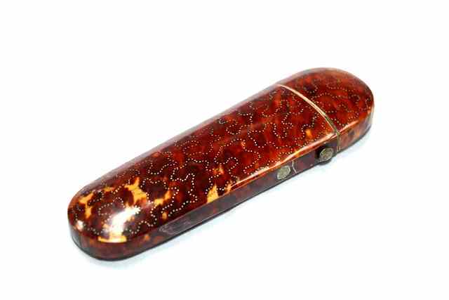 Appraisal: A GEORGIAN TORTOISESHELL SPECTACLE CASE with inlaid bead decoration long