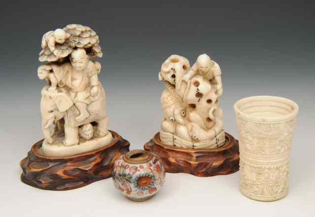 Appraisal: A JAPANESE WALRUS IVORY CARVED SMALL OKIMONO in the form