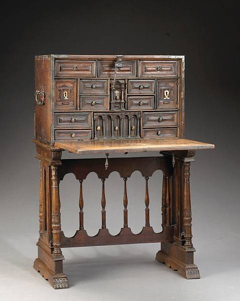 Appraisal: A Spanish Baroque iron mounted walnut vargue o on stand