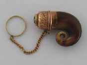 Appraisal: A Victorian Scottish gold-mounted horn vinaigrette with citrine-set cover stamped