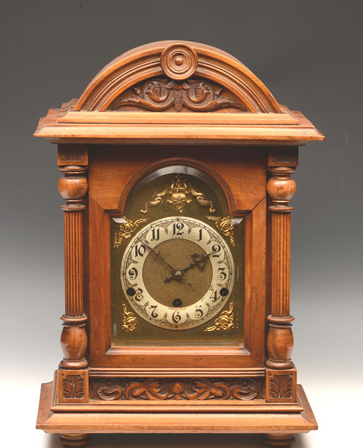 Appraisal: AN EARLY TH CENTURY GERMAN WALNUT MANTEL CLOCK the brass