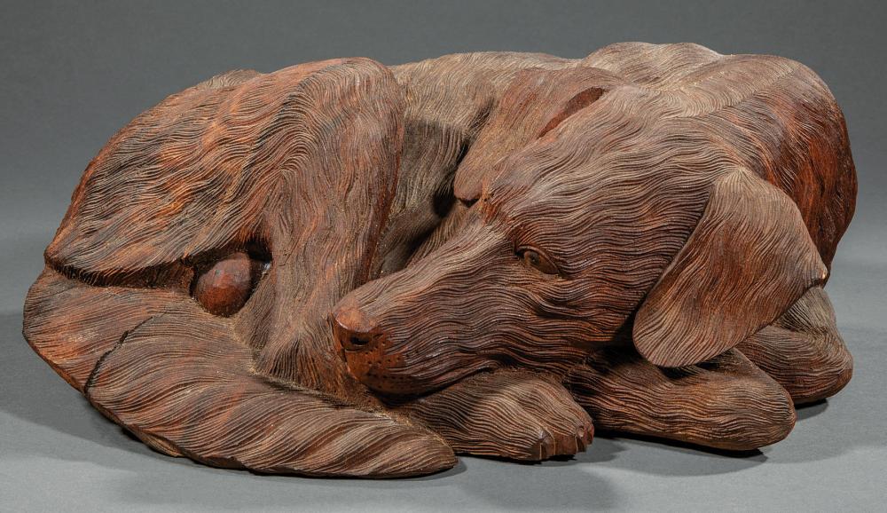 Appraisal: Carved Wood Figure of a Dog th c curled up