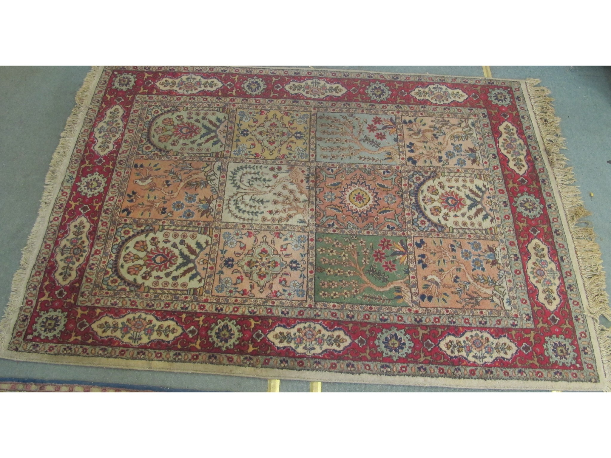 Appraisal: An Eastern rug on a multi-coloured ground cm x cm