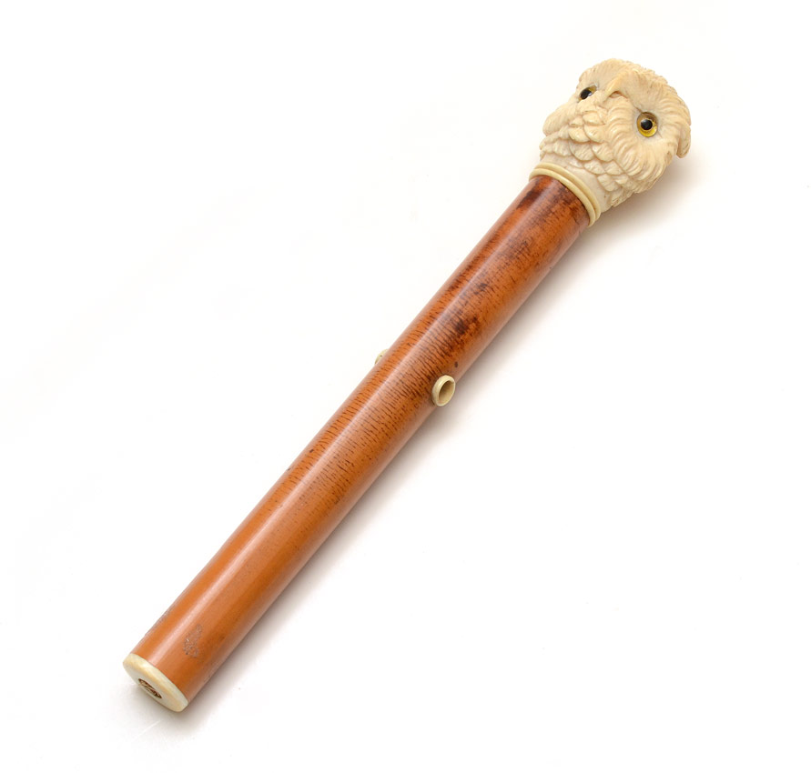 Appraisal: CARVED IVORY OWL PARASOL HANDLE Pommel in the form of