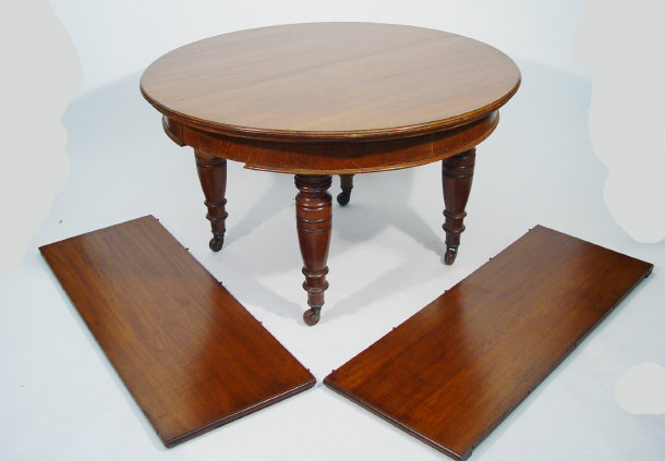 Appraisal: Victorian circular oak extending dining table with two extra leaves