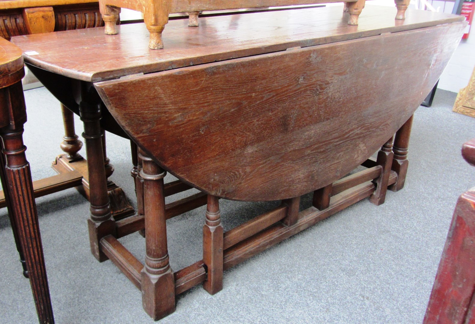 Appraisal: A large th century style oak double gate leg drop