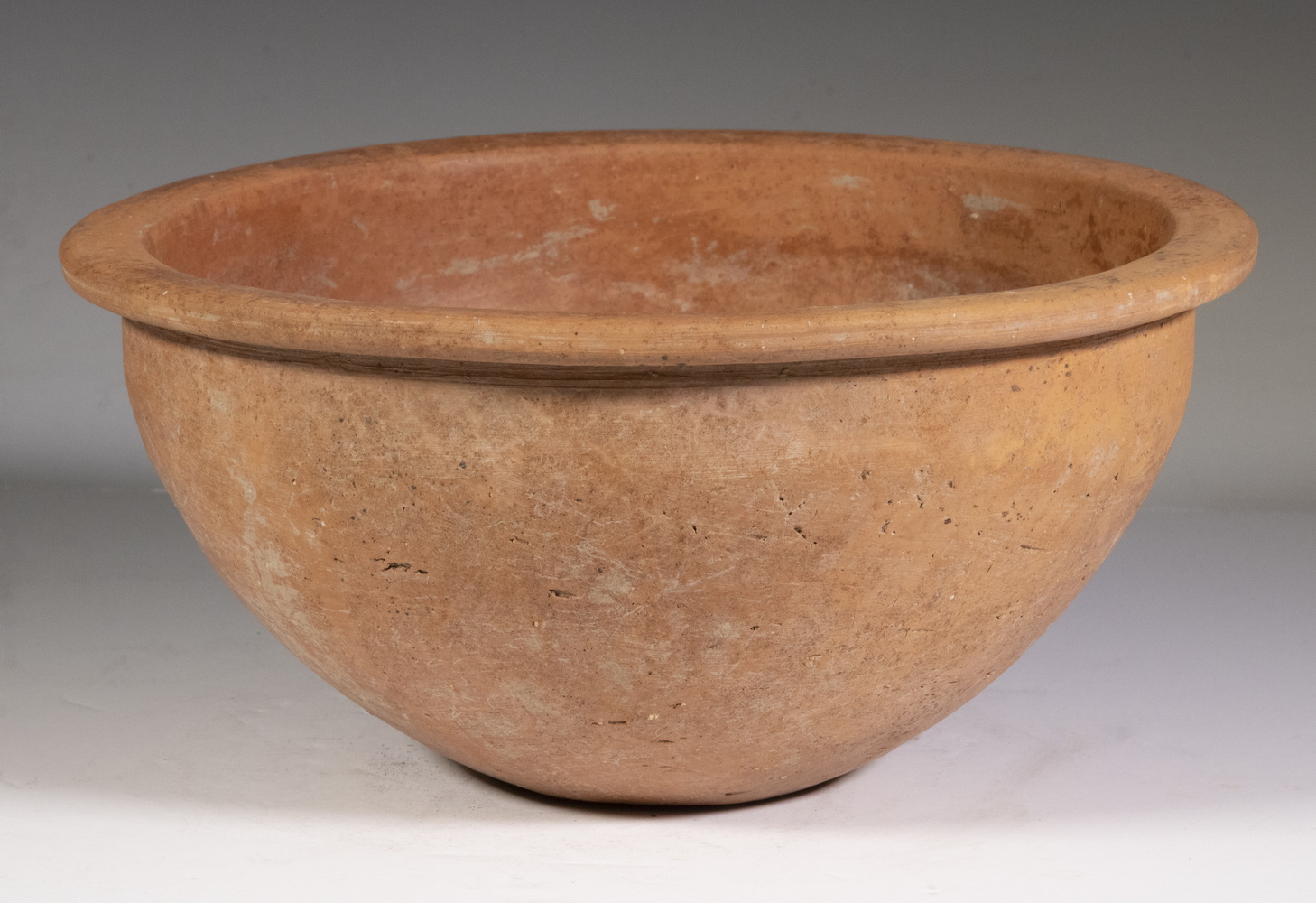 Appraisal: CHINESE ARCHAIC LARGE TERRACOTTA HALF- SPHERICAL BOWL Thick walled undecorated