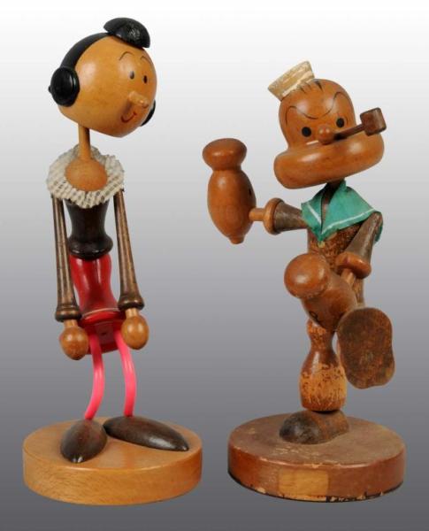 Appraisal: Pair of Wooden Popeye Olive Oyl Nodders Description Japanese Circa