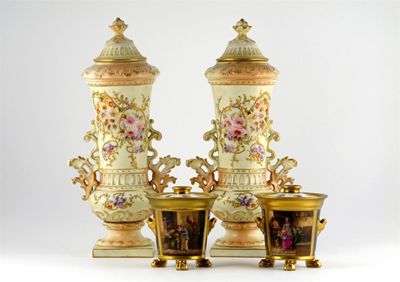 Appraisal: A pair of German porcelain flower vases and covers painted