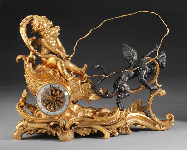 Appraisal: A Louis XV style gilt and patinated bronze mantel timepiece