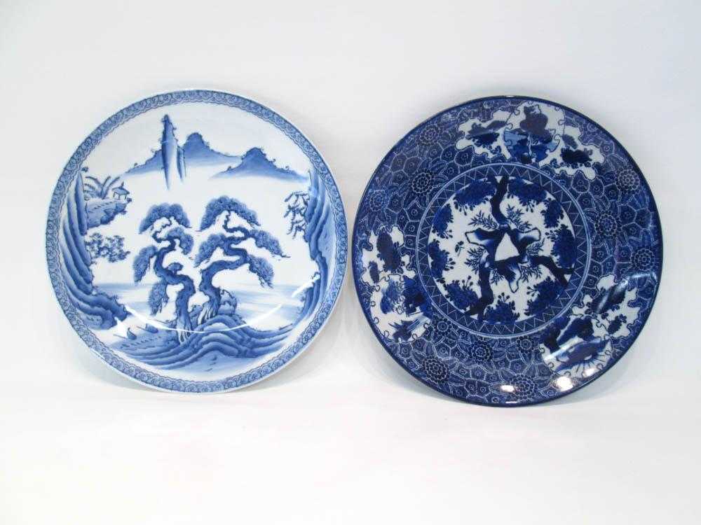 Appraisal: TWO JAPANESE PORCELAIN CHARGERS in blue and white glazes depicting