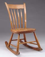 Appraisal: THUMB BACK WINDSOR ROCKER Plank seat with four arrow-type curving