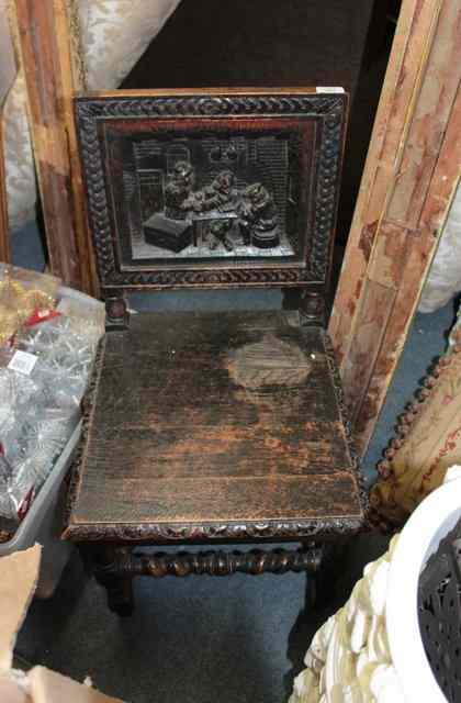 Appraisal: A VICTORIAN OAK CHAIR the solid panelled back carved in