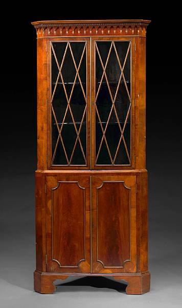 Appraisal: A George III mahogany corner cabinet late th century The