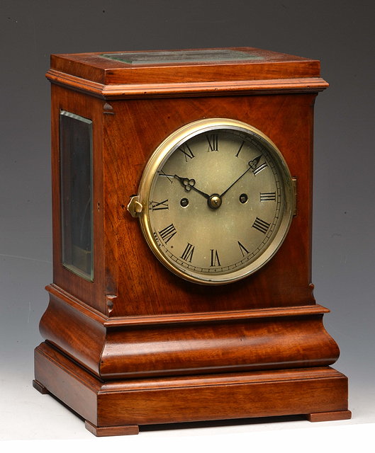 Appraisal: A MAHOGANY FOUR GLASS TABLE CLOCK with silvered Roman dial