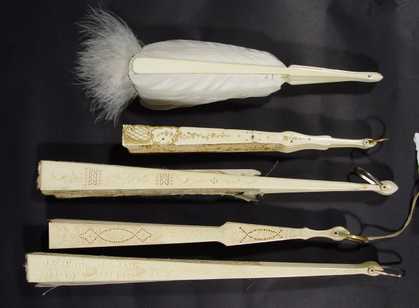 Appraisal: Five ivory and composite fans - one with feather leaves