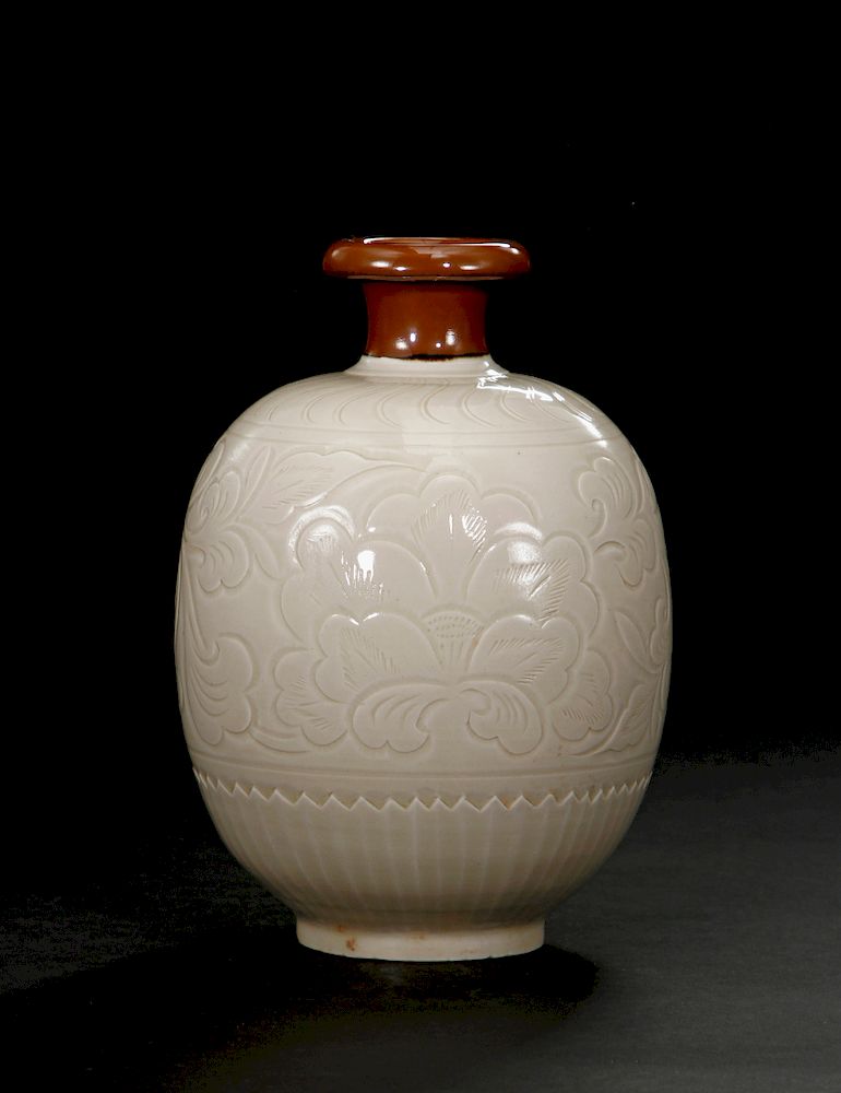 Appraisal: Rare Brown-Slip Decorated White Ding Ovoid Vase The rounded ovoid