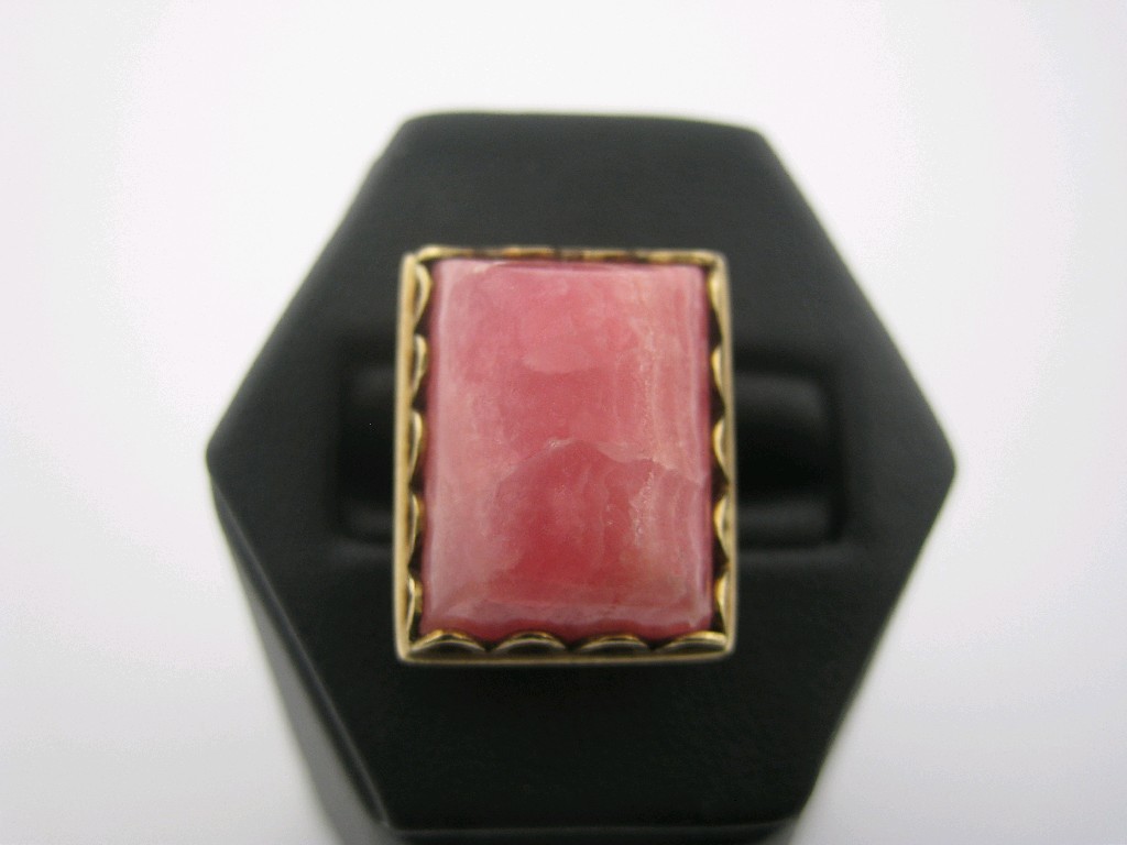 Appraisal: A Rhodocrosite Dress Ring the large oblong cabochon x mm