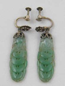 Appraisal: A pair of finely carved Chinese jadeite jade earrings circa