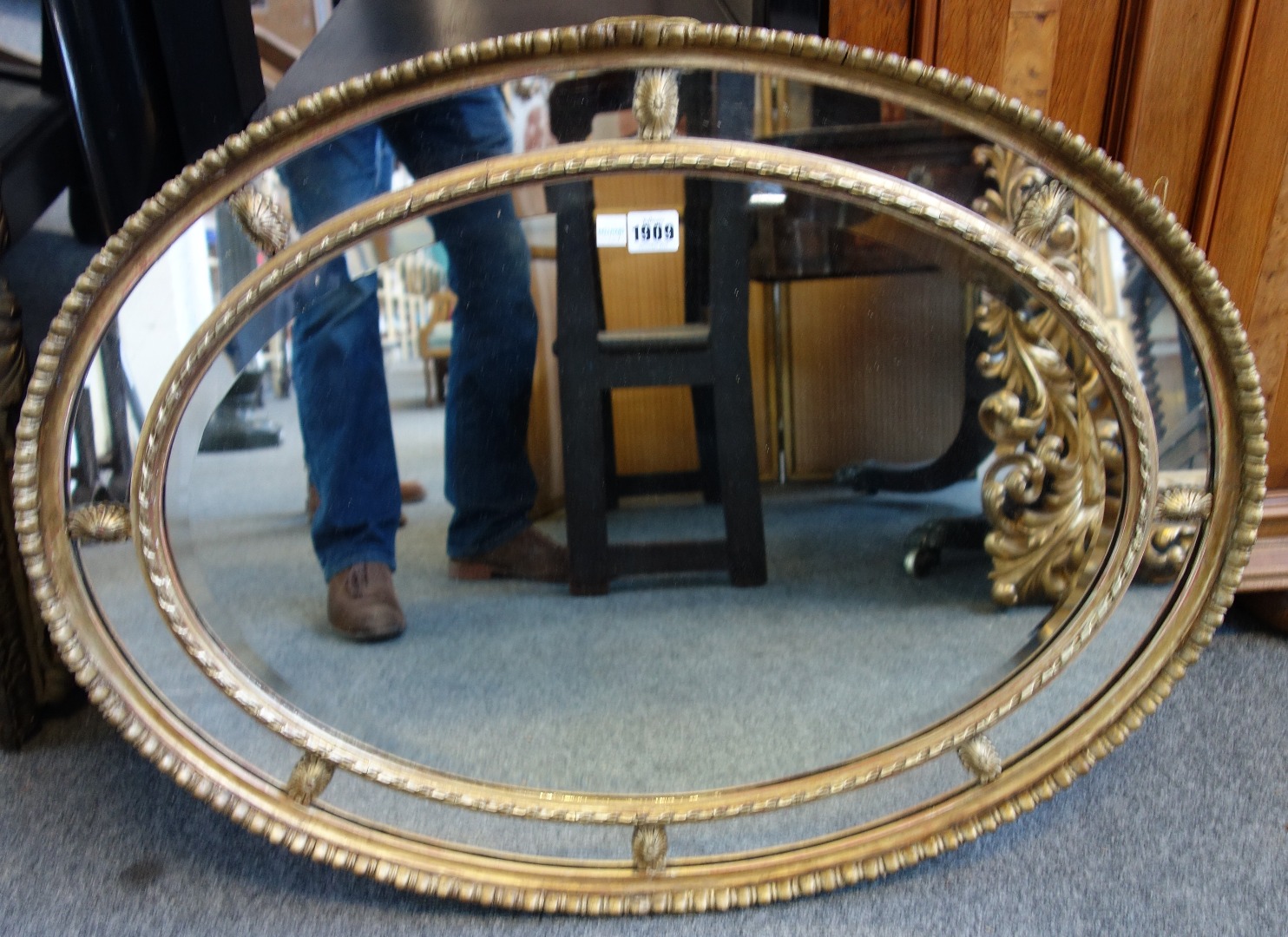 Appraisal: An early th century gilt framed oval marginal wall mirror