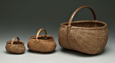 Appraisal: Three fine oak split egg baskets one with traces of