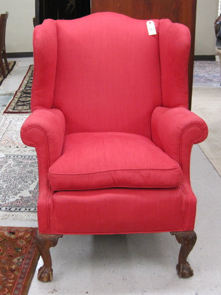 Appraisal: CHIPPENDALE STYLE WINGBACK ARMCHAIR American th century featuring red upholstery