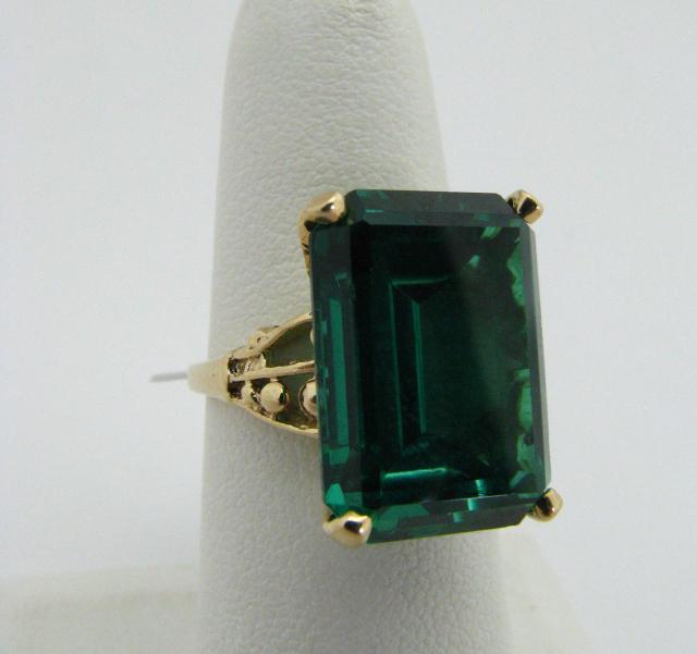 Appraisal: K yellow gold ring with rectangular created-emerald stone dwt