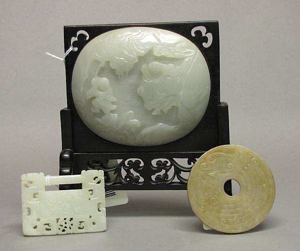 Appraisal: Three carved jade ornaments The first a thinly sectioned convex