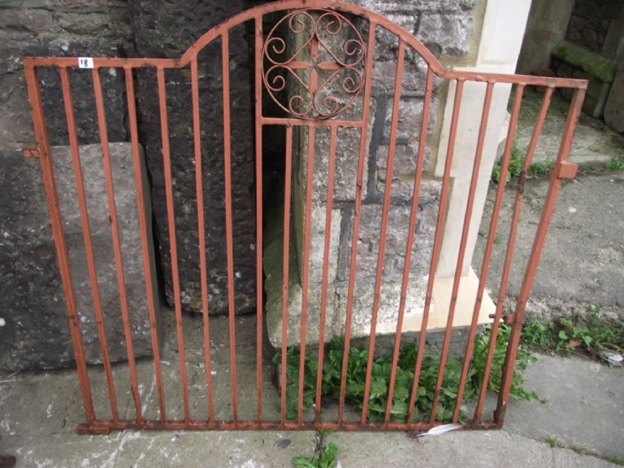 Appraisal: A pair of cast iron driveway entrance gates partially arched