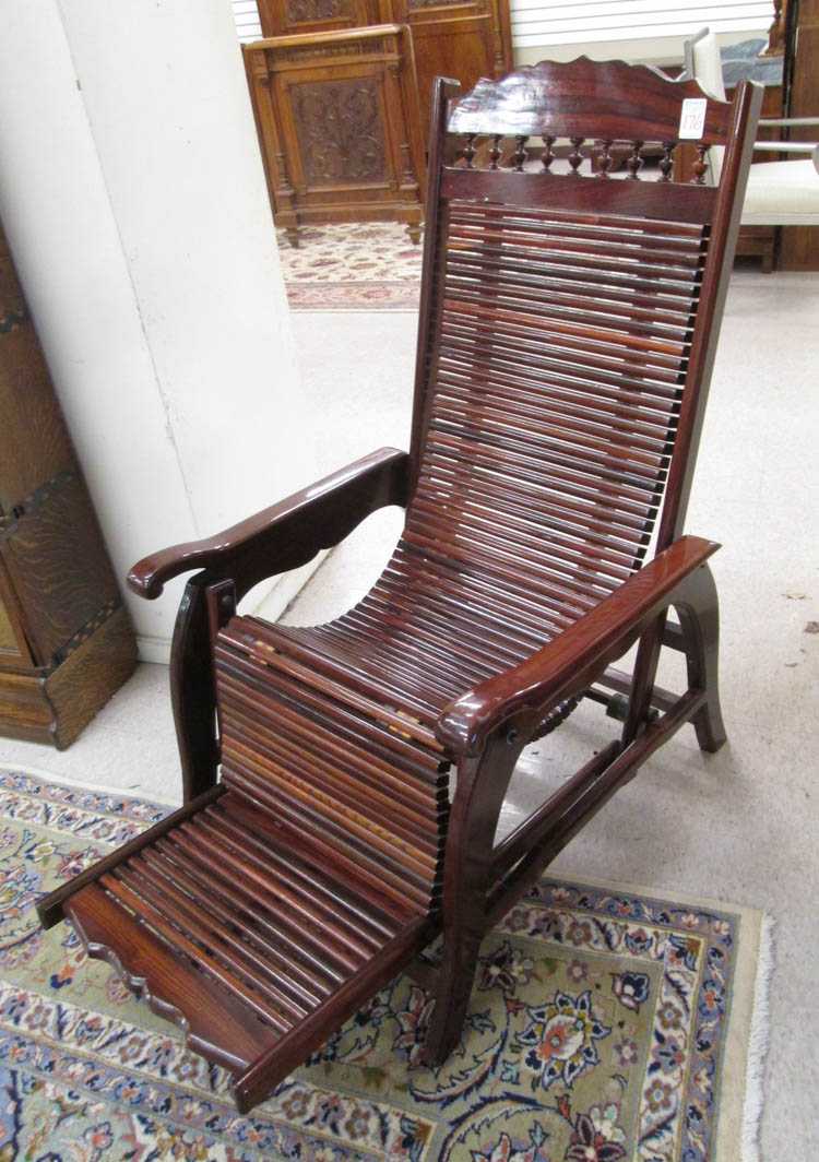 Appraisal: A BRAZILIAN ROSEWOOD LOUNGE CHAIR mid- th century design a