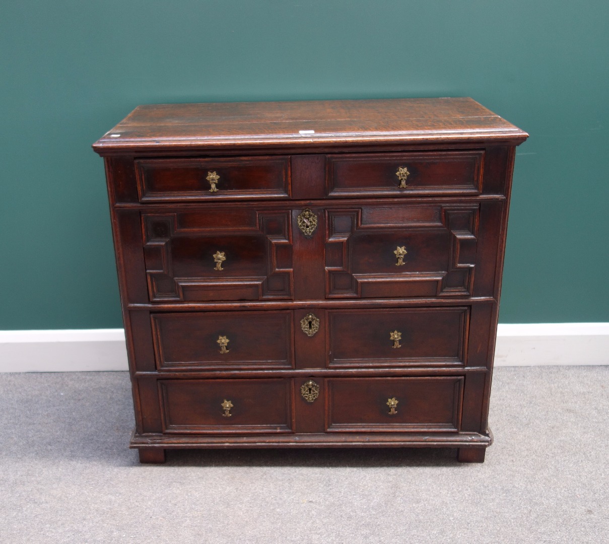 Appraisal: A late th century oak chest of four long graduated