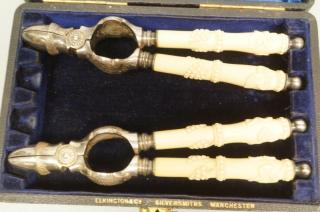 Appraisal: ELKINGTON CO Pr Antique Nut Crackers Bone hand ELKINGTON CO