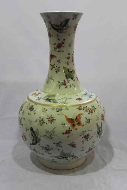 Appraisal: A CHINESE WHITE GROUND PORCELAIN BALUSTER VASE decorated in enamels