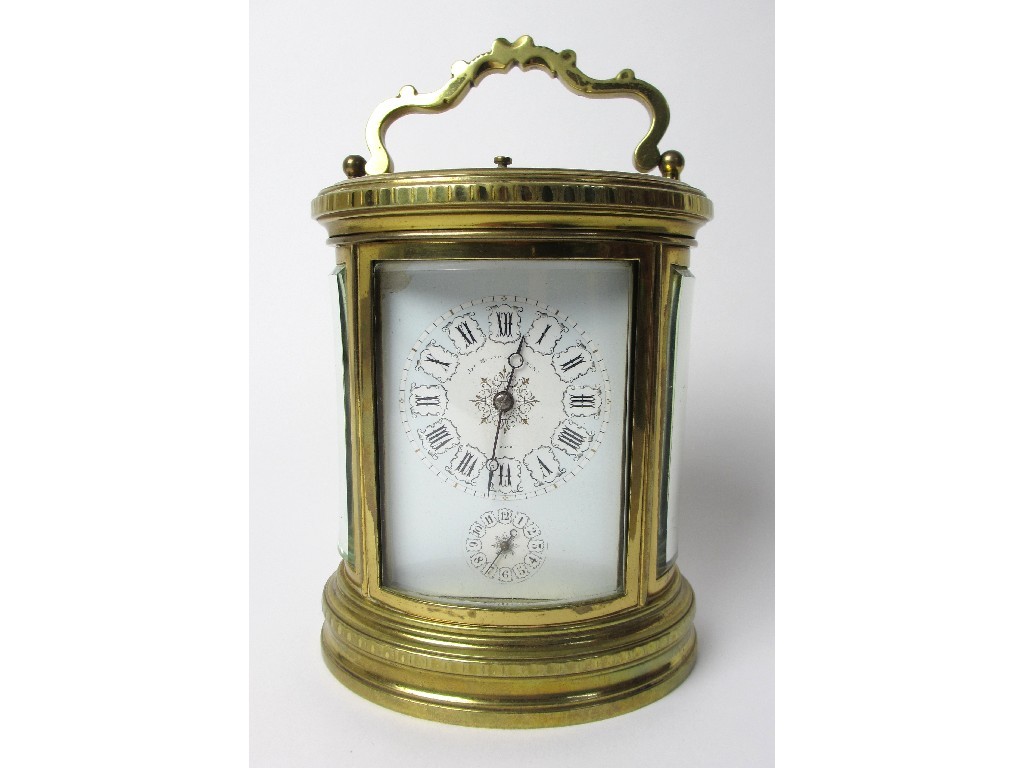 Appraisal: A French repeater carriage clock the oval brass case with