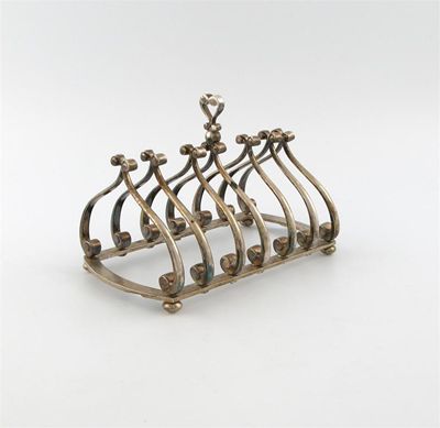 Appraisal: By Theo Fennell a modern silver seven-bar toast rack London