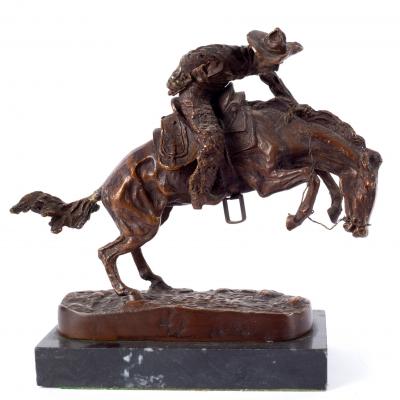 Appraisal: After Frederic Remington a bronze model of a rider with