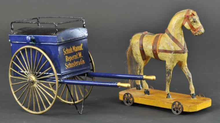 Appraisal: HAND PAINTED HORSE DRAWN CANDY CART Tin push cart w