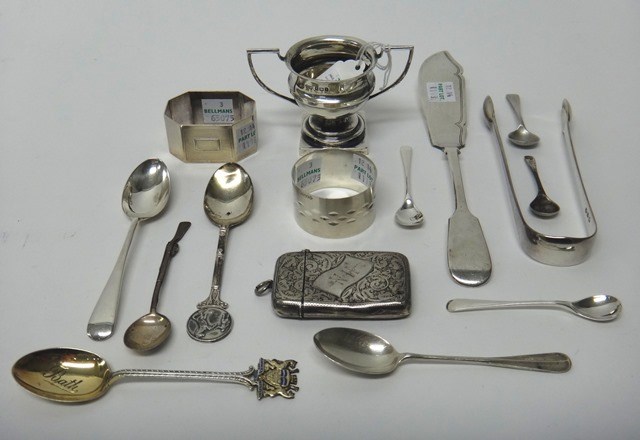 Appraisal: Silver comprising two napkin rings a twin handled trophy cup