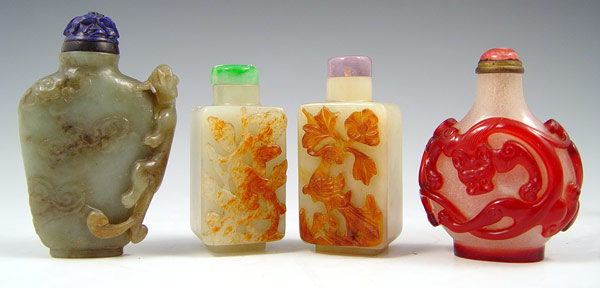 Appraisal: CHINESE SNUFF BOTTLES Three carved stone one carved glass ''