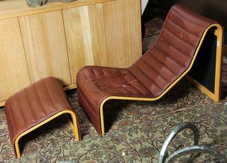 Appraisal: lot of Mid-Century Moderne lounge chair having maroon leather upholstery